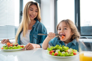 Child happily eating vegetables - no more picky eating